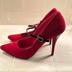 Suede like red and black heel. Signature.